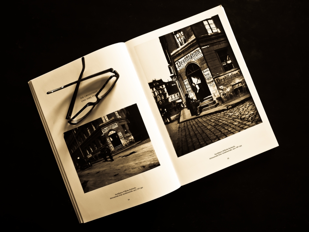 Black and white photo of a photo book with glasses