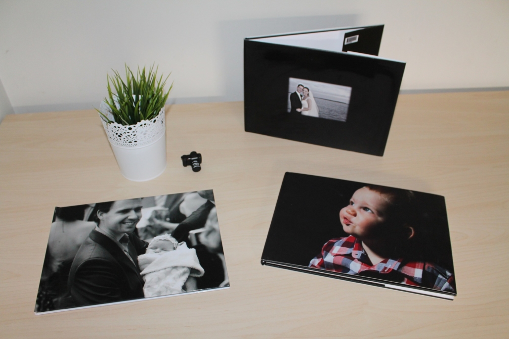 A table with family photos and a photo book