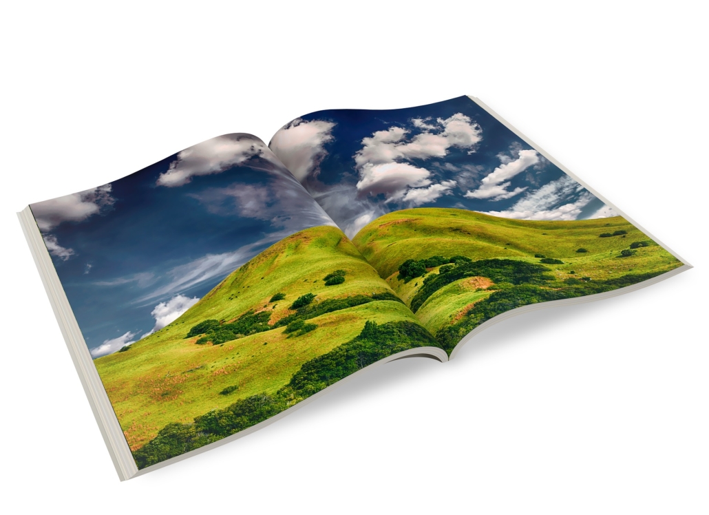 A picture of an open photo book with a landscape