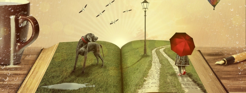 An open book where the words have been replaced with grass, a dog, and a girl with an umbrella - all representing the words coming to life