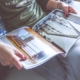 Photobook held by woman with pictures of a city